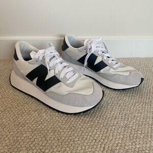 New Balance Women’s White and Black Sneakers Worn only one time.